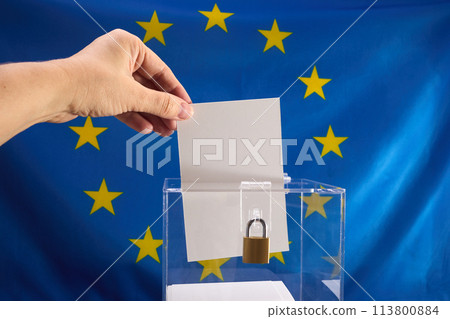 European Election Vote Concept. Hand placing a voting ballot into a clear box 113800884