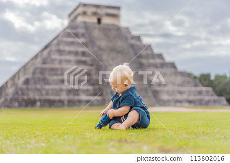 Baby traveler, tourists observing the old pyramid and temple of the castle of the Mayan architecture known as Chichen Itza these are the ruins of this ancient pre-columbian civilization and part of 113802016
