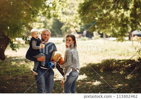 Family with little son in a autumn park Family with little son in a autumn park 113802462