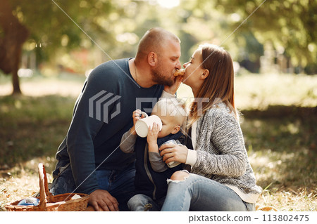 Family with little son in a autumn park Family with little son in a autumn park 113802475