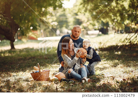 Family with little son in a autumn park Family with little son in a autumn park 113802479