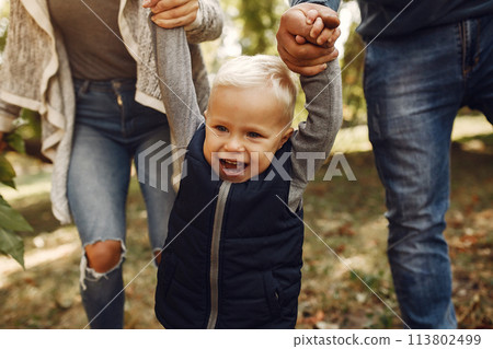 Family with little son in a autumn park Family with little son in a autumn park 113802499