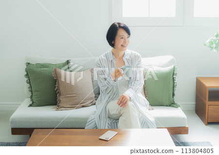 Middle-aged woman relaxing at home 113804805