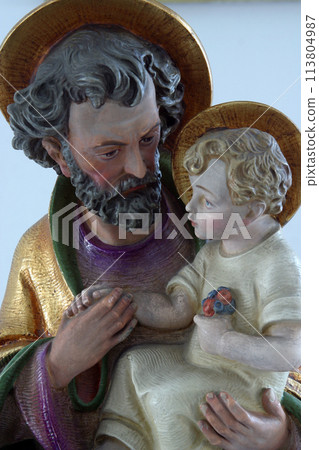Saint Joseph holding baby Jesus Saint Joseph holding baby Jesus 113804987