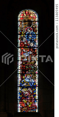 Scenes from the life of the Saint Louis, stained glass window in Basilica of the Sacre Coeur, dedicated to the Sacred Heart of Jesus in Paris, France 113805495