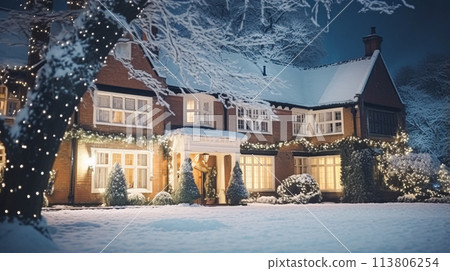 Christmas in the countryside manor, English country house mansion decorated for holidays on a snowy winter evening with snow and holiday lights, Merry Christmas and Happy Holidays 113806254
