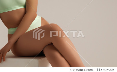 Tanned woman, perfect body shape. Fitness, weight Tanned woman, perfect body shape. Fitness, weight 113806906