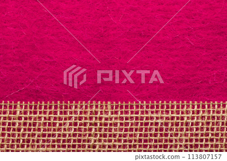 Jute mesh over pink background 113807157
