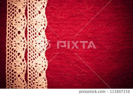 Vintage white lace over red background Vintage white lace over red background 113807158