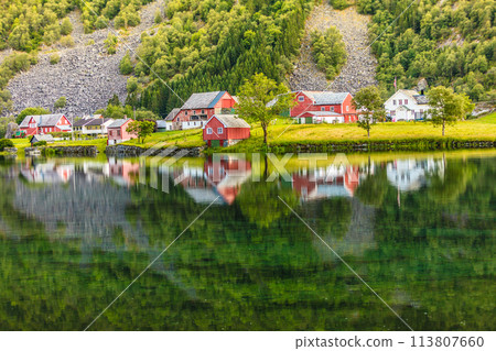 Norwegian country houses in the mountains on lake shore Norwegian country houses in the mountains on lake shore 113807660