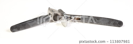 Used garlic press isolated on white Used garlic press isolated on white 113807981