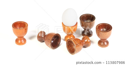 Wooden eggcups isolated on white background 113807986