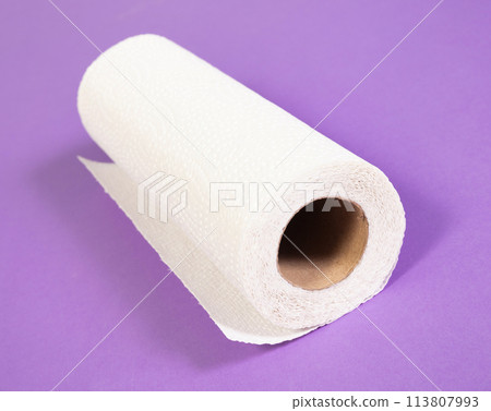 White kitchen paper isolated on purple background White kitchen paper isolated on purple background 113807993