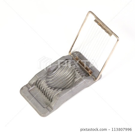 Very old egg cutter isolated Very old egg cutter isolated 113807996