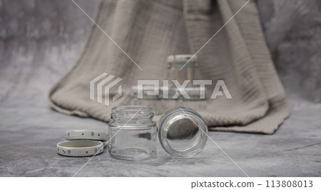 Small glass jars for sauce, jam on gray background . space for your text Small glass jars for sauce, jam on gray background . space for your text 113808013