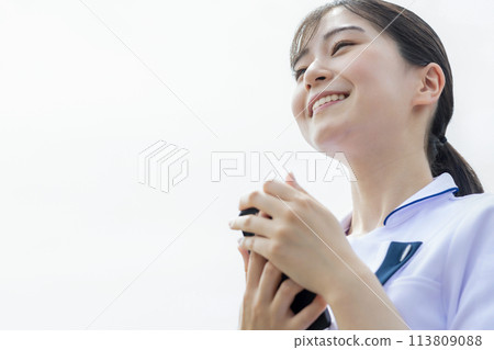 Nurse using a smartphone Nurse using a smartphone 113809088