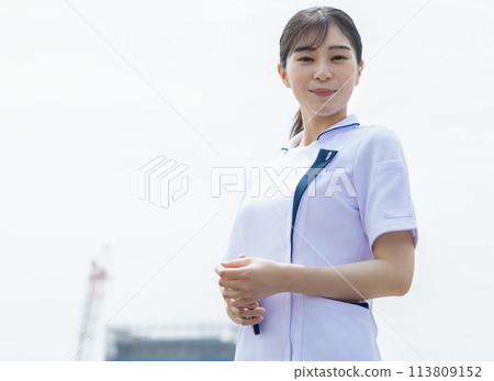 Young woman in white Young woman in white 113809152