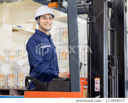 Man driving a forklift Man driving a forklift 113809337