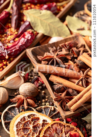 Various spices on a kitchen table. 113810054