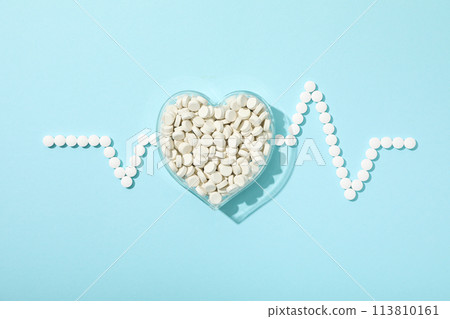 Heart with a cardiogram on a light background. 113810161