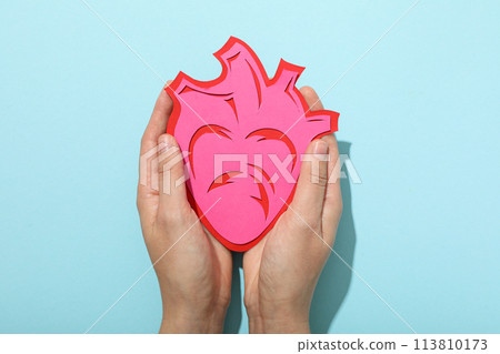 Heart on a blue background, the concept of treating cardiovascular diseases. Heart on a blue background, the concept of treating cardiovascular diseases. 113810173