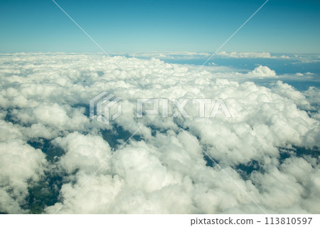 Skyscape seen from an airplane window Skyscape seen from an airplane window 113810597