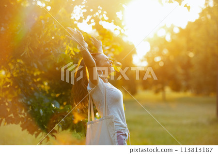 smiling elegant woman in white shirt rejoicing 113813187