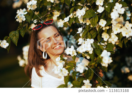 Portrait of happy young 40 years old woman in white shirt Portrait of happy young 40 years old woman in white shirt 113813188
