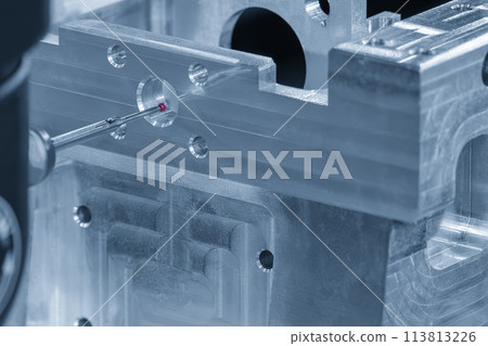 Closeup scene the multi-axis CMM machine measuring the aluminum automotive parts. 113813226