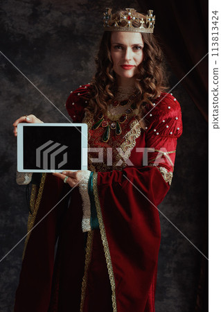 medieval queen in red dress digital tablet blank screen medieval queen in red dress digital tablet blank screen 113813424