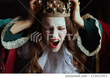 shocked medieval queen in red dress with white collar 113813451