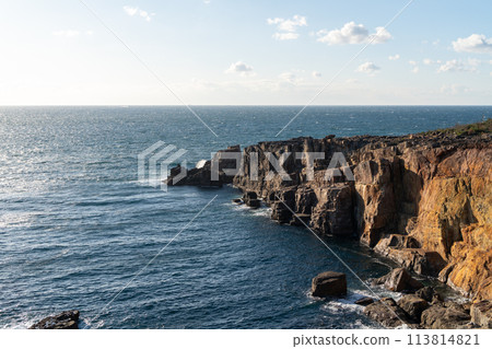The cliffs of the cliffs of the cliffs and the horizon seen in the distance 113814821