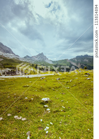 landscape with mountains, clouds and rocks landscape with mountains, clouds and rocks 113814894