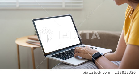 Young female with laptop at home on white blank screen for montage mockup display device in concept of lifestyle work at home Young female with laptop at home on white blank screen for montage mockup display device in concept of lifestyle work at home 113815326
