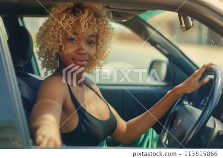 Young and cheerful afro woman driver enjoying new car steering wheel sitting inside. Happy female driving modern car. Beautiful successful girl steering wheel in good mood. Excellent trip auto travel 113815866