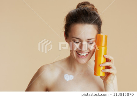 smiling modern 40 years old woman with cosmetic cream jar smiling modern 40 years old woman with cosmetic cream jar 113815870