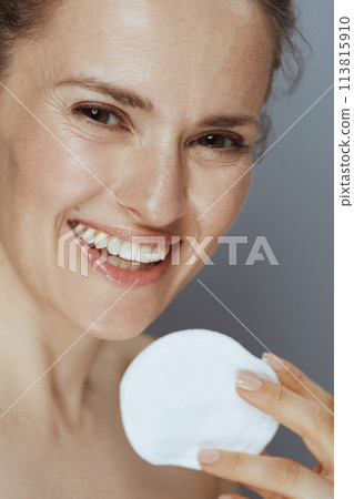 happy young woman with cotton pad happy young woman with cotton pad 113815910