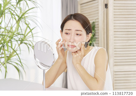 Middle-aged woman suffering from nasolabial folds 113817720