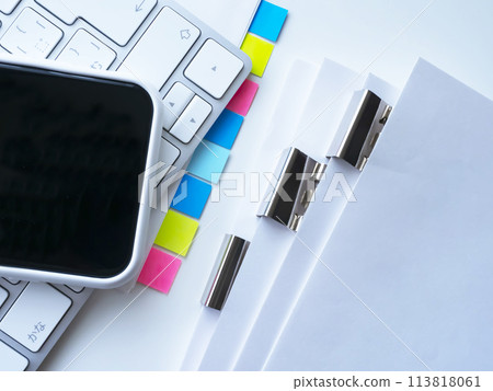 Documents, keyboard and smartphone placed on the table Documents, keyboard and smartphone placed on the table 113818061