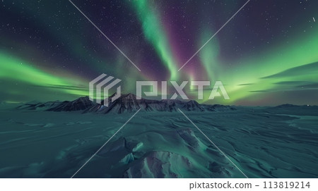 Aurora dancing in the sky above a snowcovered mountain range 113819214
