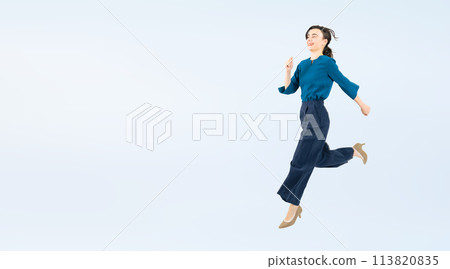 Full body photo of a white woman jumping 113820835