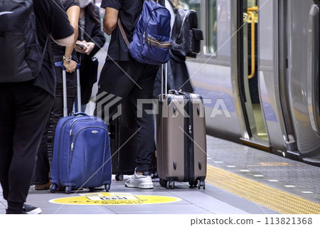 Travelers waiting for a train at Kansai Airport Station 113821368