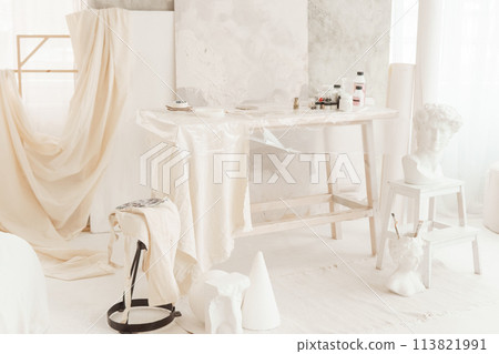 The interior of the art workshop is decorated in bright colors. Working materials of the artist and the sculptor. 113821991