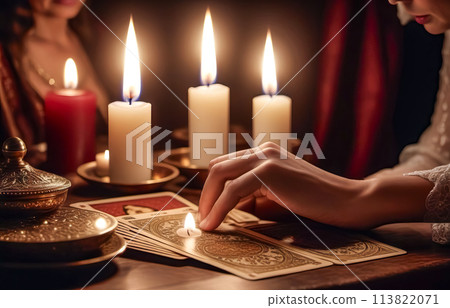 A beautiful mysterious fortune teller with piercing eyes predicts fate on a magic ball 113822071