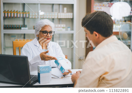 Pharmacist giving advice And advice for patients who come to buy Medicine, Drugs, Vitamins products, according to prescriptions in modern pharmacies. 113822891