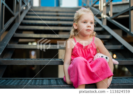 Child head with cochlear implant hearing aid. Hearing aid and medicine innovating technology and diversity Inclusion and people with disability concept. Copy space 113824559