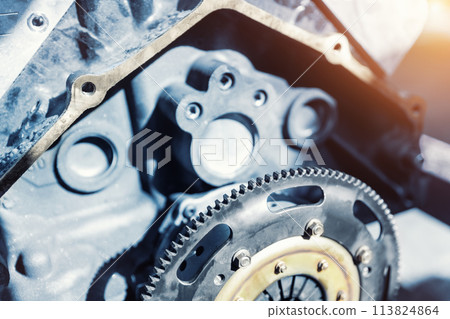 Closeup car racing motorsport engine flywheel parts garage workshop workbench repair factory station fix service maintenance. Vehicle part detail. Mechanical precision automotive engineering Closeup car racing motorsport engine flywheel parts garage workshop workbench repair factory station fix service maintenance. Vehicle part detail. Mechanical precision automotive engineering 113824864