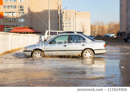 old Nissan Primera car in frozen water. winter accident. Pavlodar, Kazakhstan - 12.28.2022. 113824908