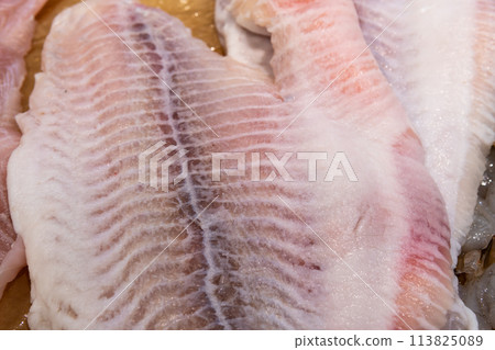 Fresh fish lies on ice in a supermarket Fresh fish lies on ice in a supermarket 113825089