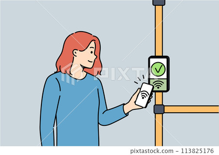 Woman uses bus terminal to accept contactless payments by touching phone to NFC sensor 113825176